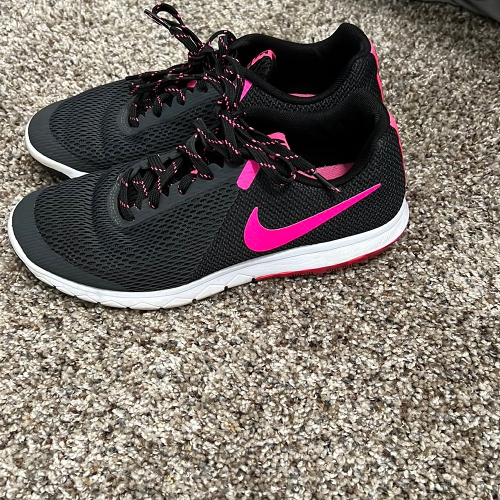 Nike running shoe pink and black mesh material